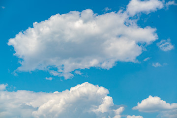 Obraz na płótnie Canvas White clouds against the blue sky