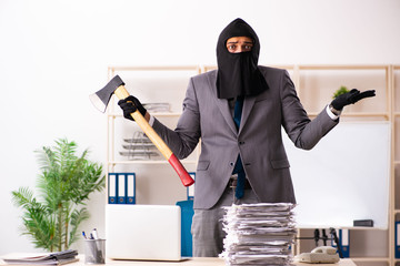 Male gangster stealing information from the office 