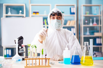 Male biotechnology scientist chemist working in the lab