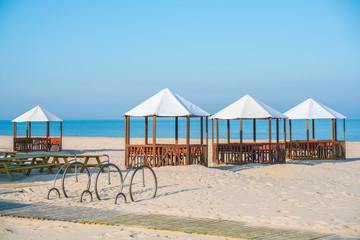 A place to relax on the beach in the early morning. Canopies for protection from the sun. Weather forecast.