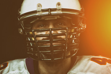 Portrait close-up, American football player, bearded in helmet. Concept American football,...
