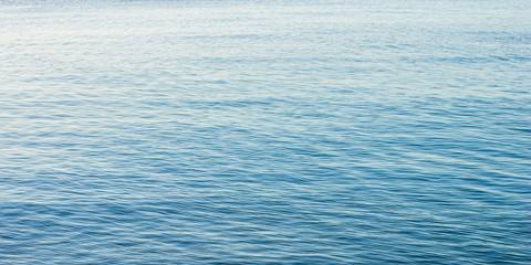 calm water background surface panorama format, copy space