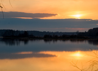 Obraz premium Early spring. Beautiful sunset on the wild nature. Forest river