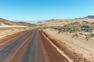 Road running through desert landscape, Atacama, Chile .