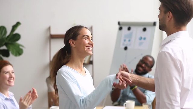 Executive boss handshaking promoting congratulating excited happy intern employee