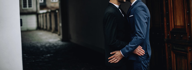 Gay couple walking around the city.