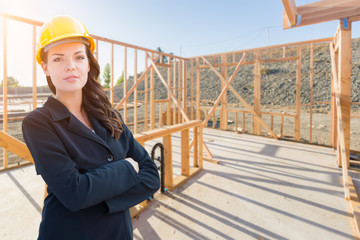 Female Contractor In Hard Hat At Construction Site