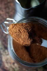 FIRST PLANE OF SPOON WITH GROUND COFFEE