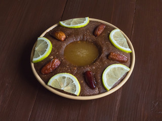 Saudi Arabia traditional dish Hineni, it is a mixed of dates and whole wheat. Ramadan food