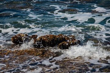  broken waves on the rocks