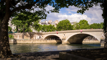 Fototapeta na wymiar Parisian bridge and the Seine river seen from Saint Louis island - Paris, France