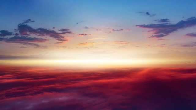 Beautiful sunset .  Beautiful heavenly landscape with the sun in the clouds . View of clouds from high altitude . Paradise heaven .light about the sky .