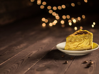 pancake cake with cream and coffee on a white saucer