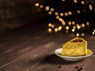 pancake cake with cream and coffee on a white saucer