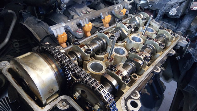 Closeup of opened gasoline engine bay.