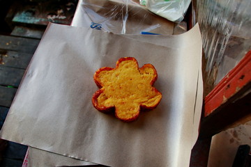 cake maker while working in the kitchen making a typical South Kalimantan Bingka cake in Banjarmasin - Indonesia