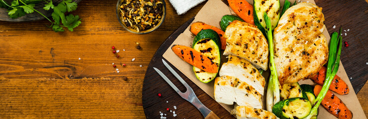 Grilled Chicken Breasts with Grilled Vegetables Zucchini and Carrot. Selective focus.