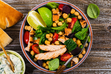 Mediterranean Grilled Chicken Salad with Chickpea or Garbanzo Beans. Selective focus.