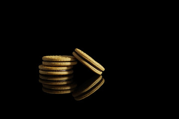 Biscuits sweet cookie isolated on black background