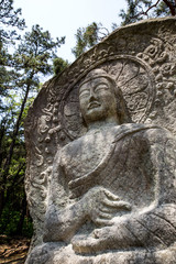 Fototapeta na wymiar Singyeri Seated Rock-carved Buddha in Namwon-si, south korea.