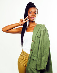 young pretty african-american girl posing cheerful emotional on white background isolated, lifestyle people concept close up