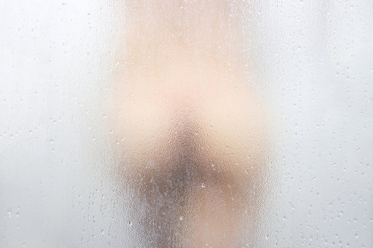 Picture of a woman's butt. She is bathing in the bathroom at her house.