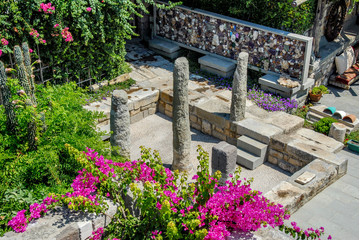 Fototapeta na wymiar Mugla, Turkey, 25 July 2012: Authentic Stone Bodrum Mansion, Halicarnassus. King of Karia mausolos columns.
