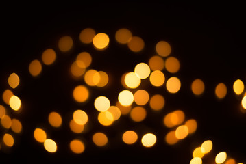 abstract gold bokeh light effect with dark background