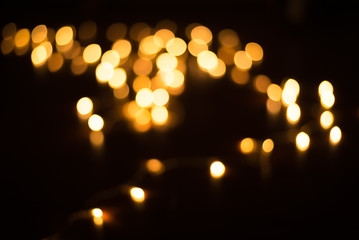 abstract gold bokeh light effect with dark background