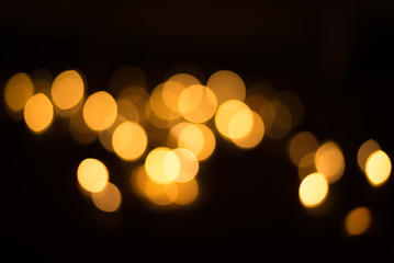 abstract gold bokeh light effect with dark background