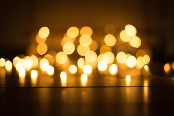 abstract gold bokeh light effect with dark background