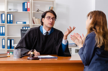 Young woman visiting male lawyer 