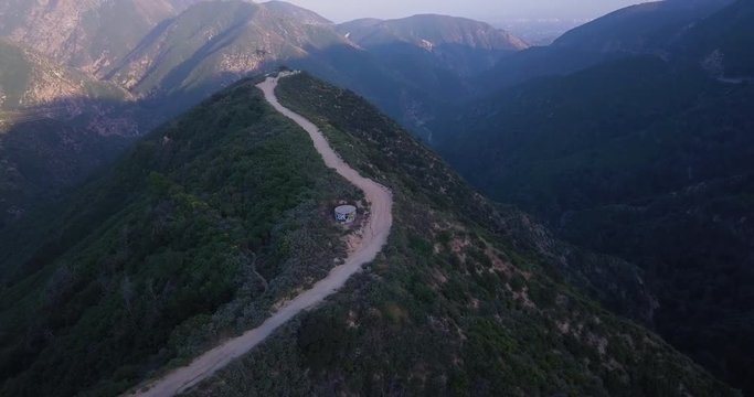 San Gabriel Mountains in California, in dusk or perhaps during the sunrise.
Following a trail or path to a lookout point is a great climp for sport lovers.
Hiking, activity, sunrise, sunset concept.