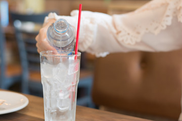 Clean drinking water from safe plastic bottles, Pouring into a glass,