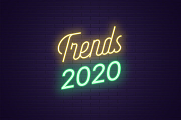 Neon lettering of Trends 2020. Glowing bright text