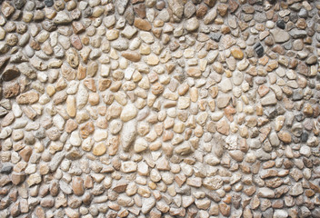 Nature patterns texture of multicolored stone decorative on concrete wall  for background