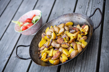 grilled potatos with onionin and salad