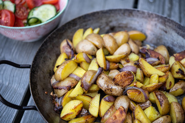 grilled potatos with onionin and salad