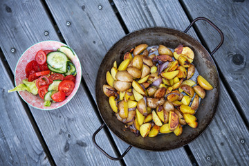 grilled potatos with onionin and salad