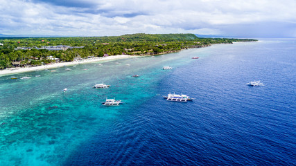 Panorama Aerial drone picture of the white sand Alona Beach in Panglao, Bohol, Philippines