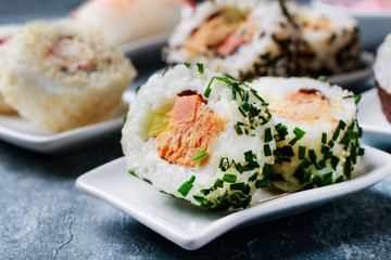 Sushi set on grey stone background.