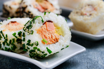 Sushi set on grey stone background.