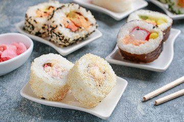 Sushi set on grey stone background.