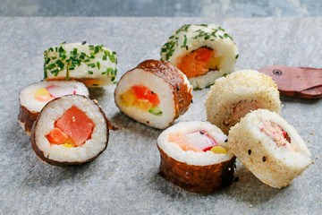 Sushi set on grey stone background.