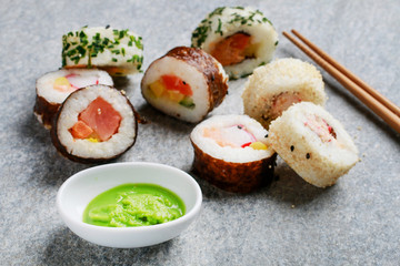 Sushi set on grey stone background.