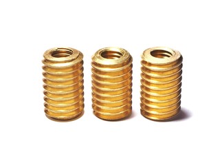 Screw made of brass for repairing damaged screw holes. On a white background.