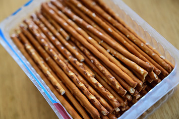 Salty thin sticks in plastic wrap.