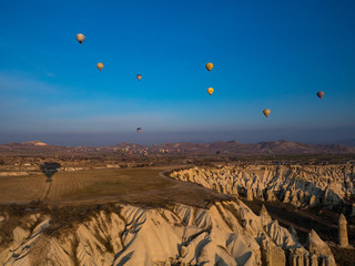 Turkey - February, 2019: Magnificent dawn with hot air balloons. Cappadocia, Goreme