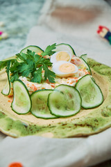 Children's salad with crab and cucumber slices 
