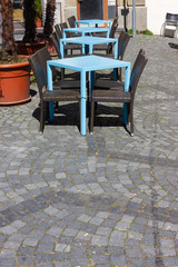Fototapeta na wymiar cafe with table and chairs at street
